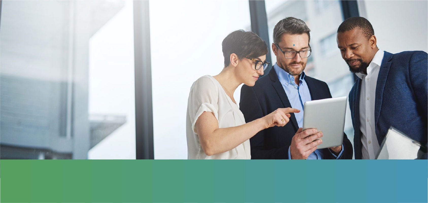 Businessman demonstrating a tablet app to his colleagues