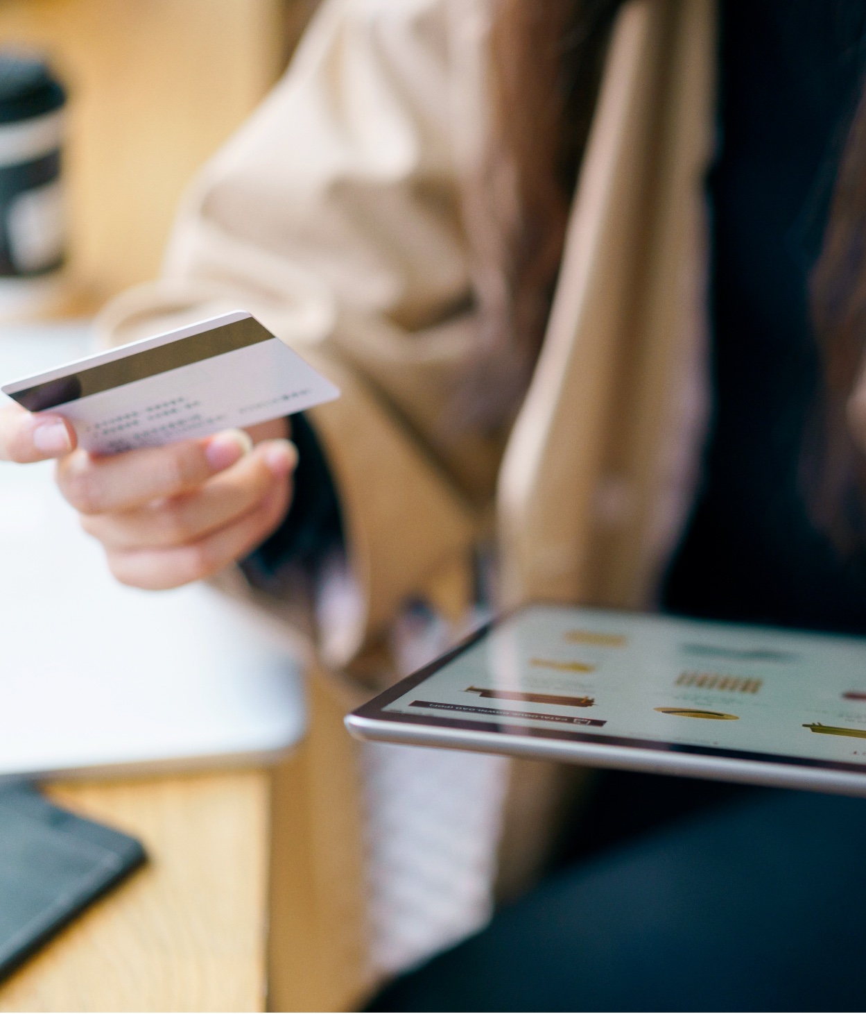 Shopper preparing to use their credit card to make an online purchase.